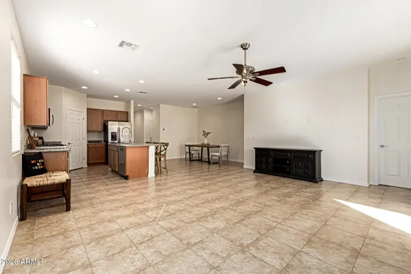 a view of a kitchen with a sink stainless steel appliances and cabinets