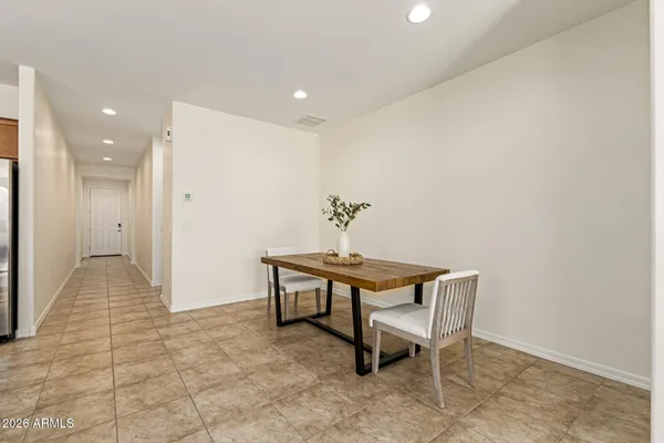 a view of a hallway with seating area