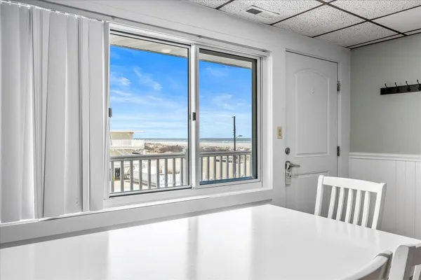 a kitchen with stainless steel appliances granite countertop a stove top oven microwave and refrigerator
