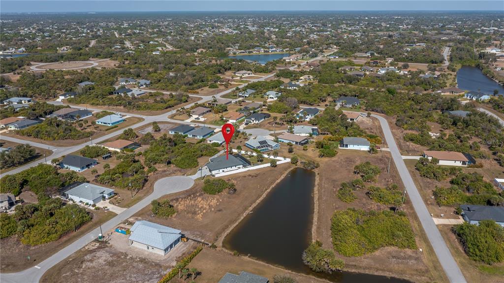 159 April Road Rotonda West, FL 33947 - Photo 11 of 73 an aerial view of residential houses with outdoor space