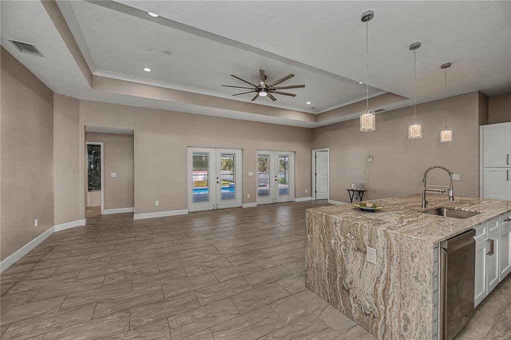 159 April Road Rotonda West, FL 33947 - Photo 14 of 73 a view of a kitchen with a sink stainless steel appliances and cabinets