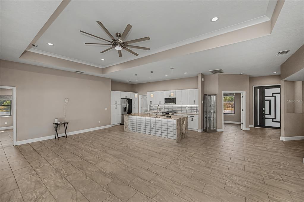 159 April Road Rotonda West, FL 33947 - Photo 16 of 73 a view of kitchen with cabinets and wooden floor
