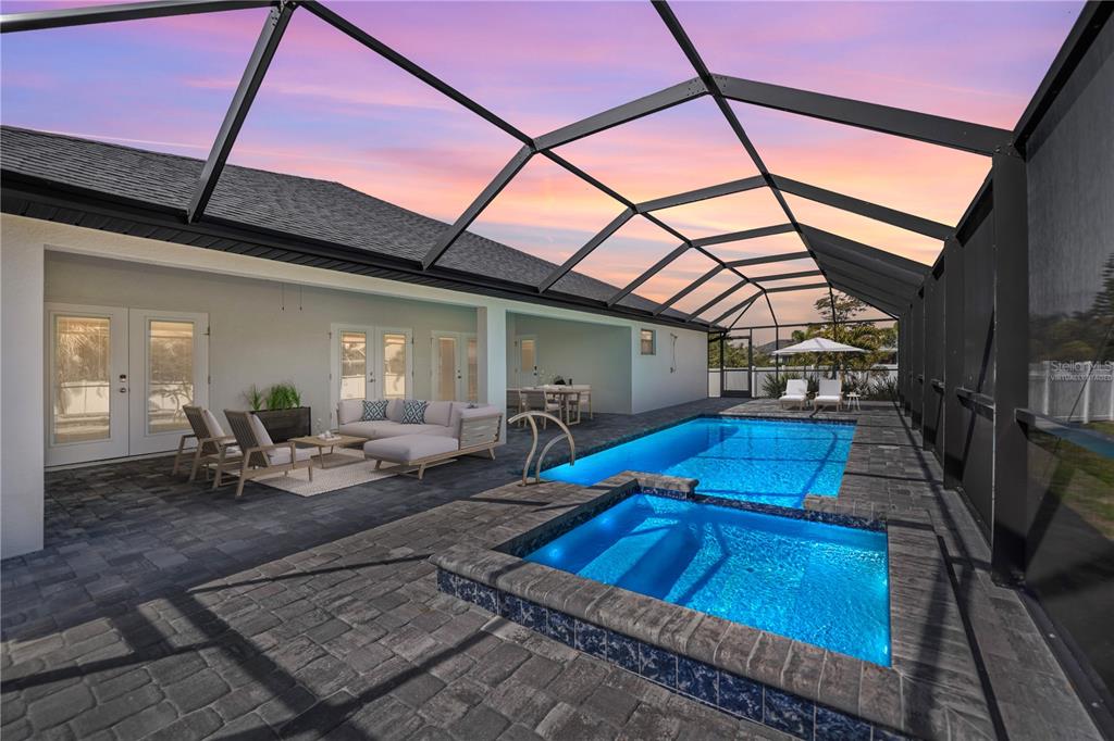 159 April Road Rotonda West, FL 33947 - Photo 2 of 73 a view of a chairs and table in the patio