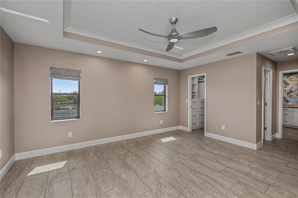 159 April Road Rotonda West, FL 33947 - Photo 29 of 73 wooden floor in an empty room with a window