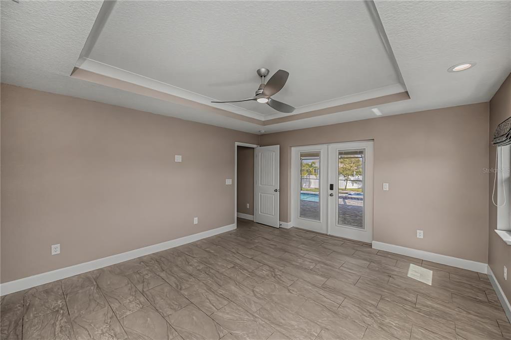 159 April Road Rotonda West, FL 33947 - Photo 30 of 73 wooden floor in an empty room with a window