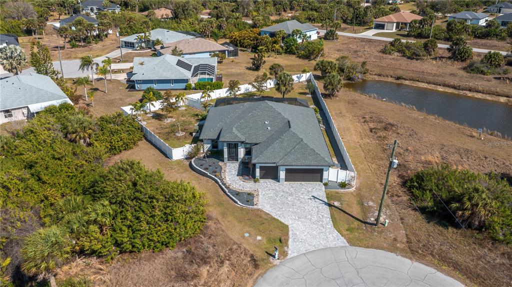 159 April Road Rotonda West, FL 33947 - Photo 3 of 73 an aerial view of a house with a yard basket ball court and outdoor seating