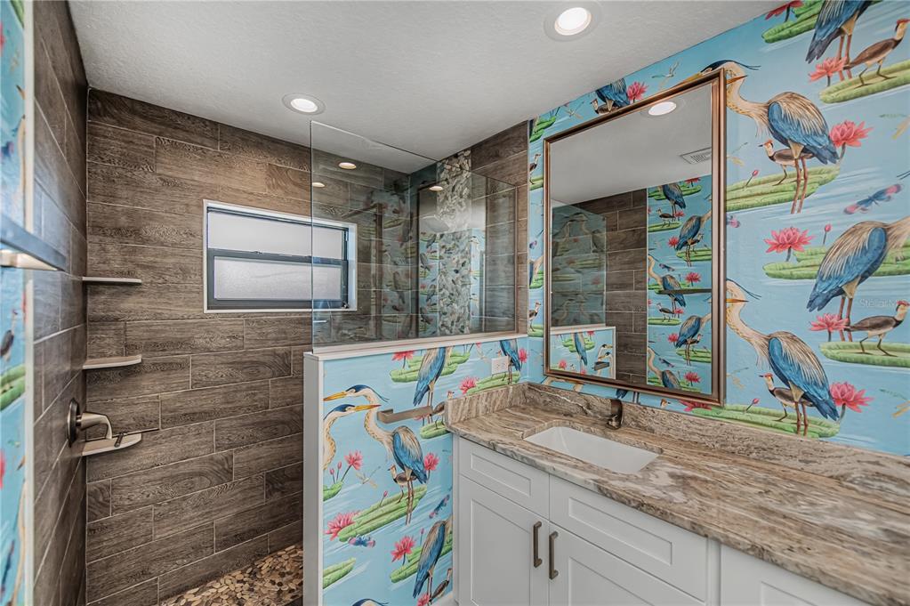 159 April Road Rotonda West, FL 33947 - Photo 36 of 73 a bathroom with a sink a vanity and a mirror