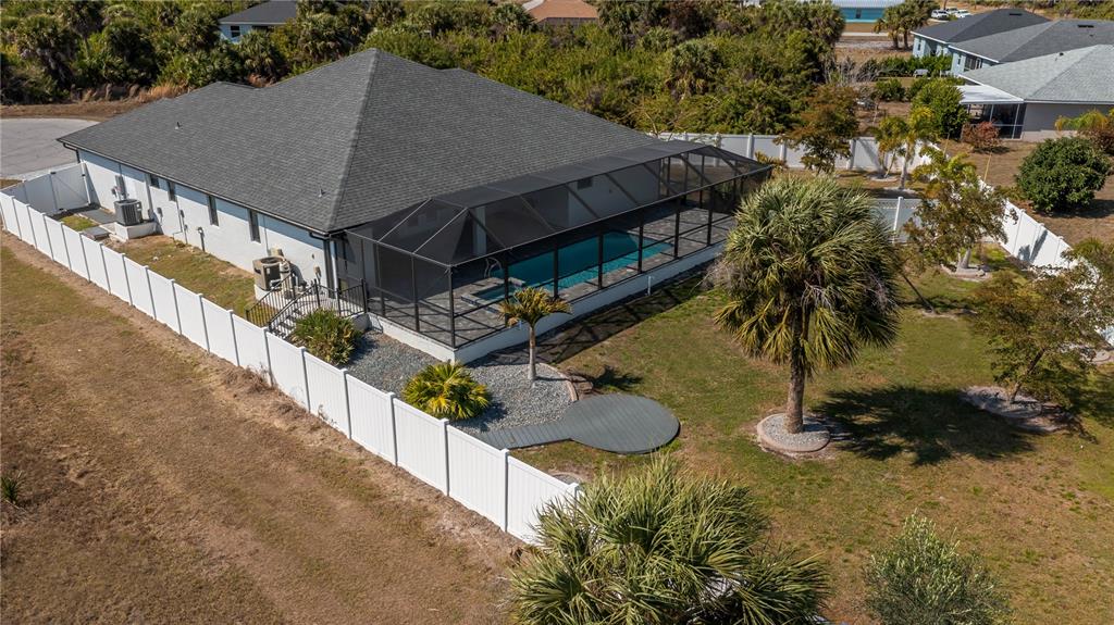 159 April Road Rotonda West, FL 33947 - Photo 4 of 73 a aerial view of a house roof deck with couches and dinning table