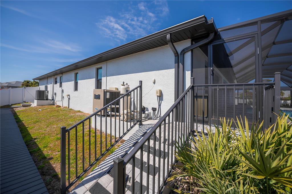 159 April Road Rotonda West, FL 33947 - Photo 58 of 73 a view of staircase with railing and white walls