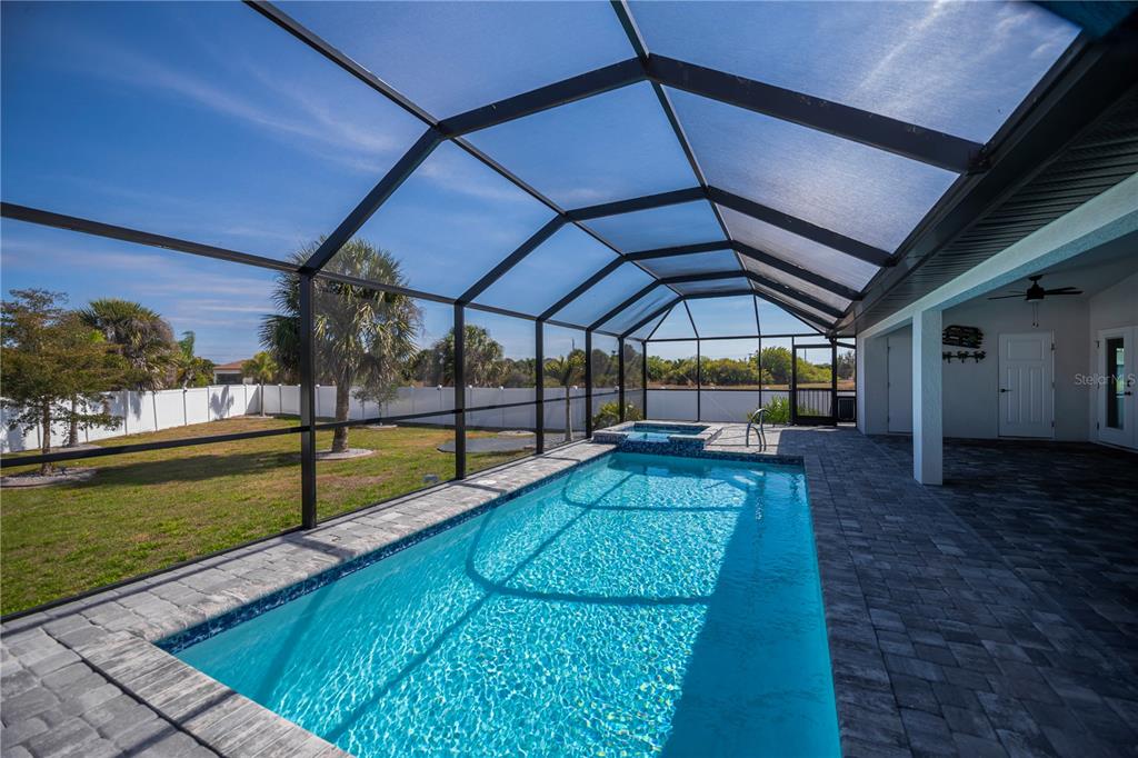 159 April Road Rotonda West, FL 33947 - Photo 6 of 73 a view of swimming pool with a backyard