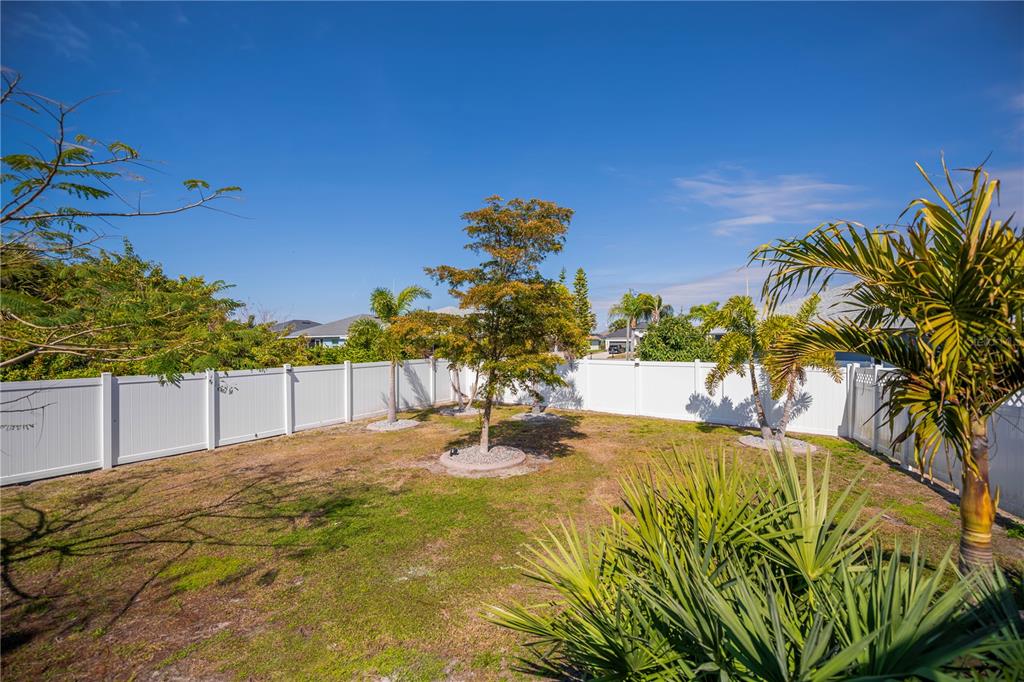 159 April Road Rotonda West, FL 33947 - Photo 62 of 73 a swimming pool with plants