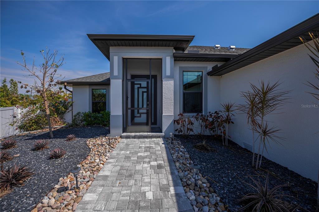 159 April Road Rotonda West, FL 33947 - Photo 7 of 73 a house view with a garden space