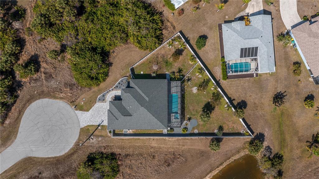159 April Road Rotonda West, FL 33947 - Photo 10 of 73 an aerial view of a house with a yard