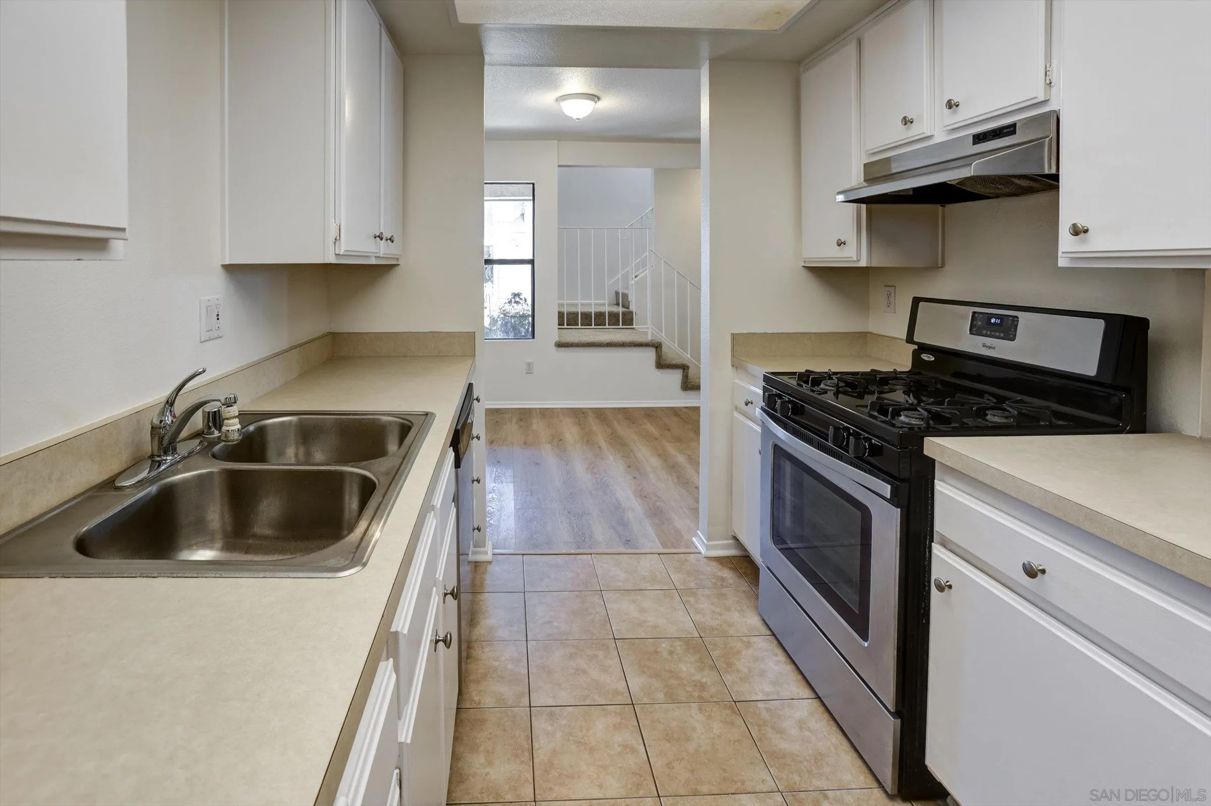 13230 Johannesberg Way, Unit 10 Poway, CA 92064 - Photo 12 of 40 a kitchen with granite countertop a stove and a sink