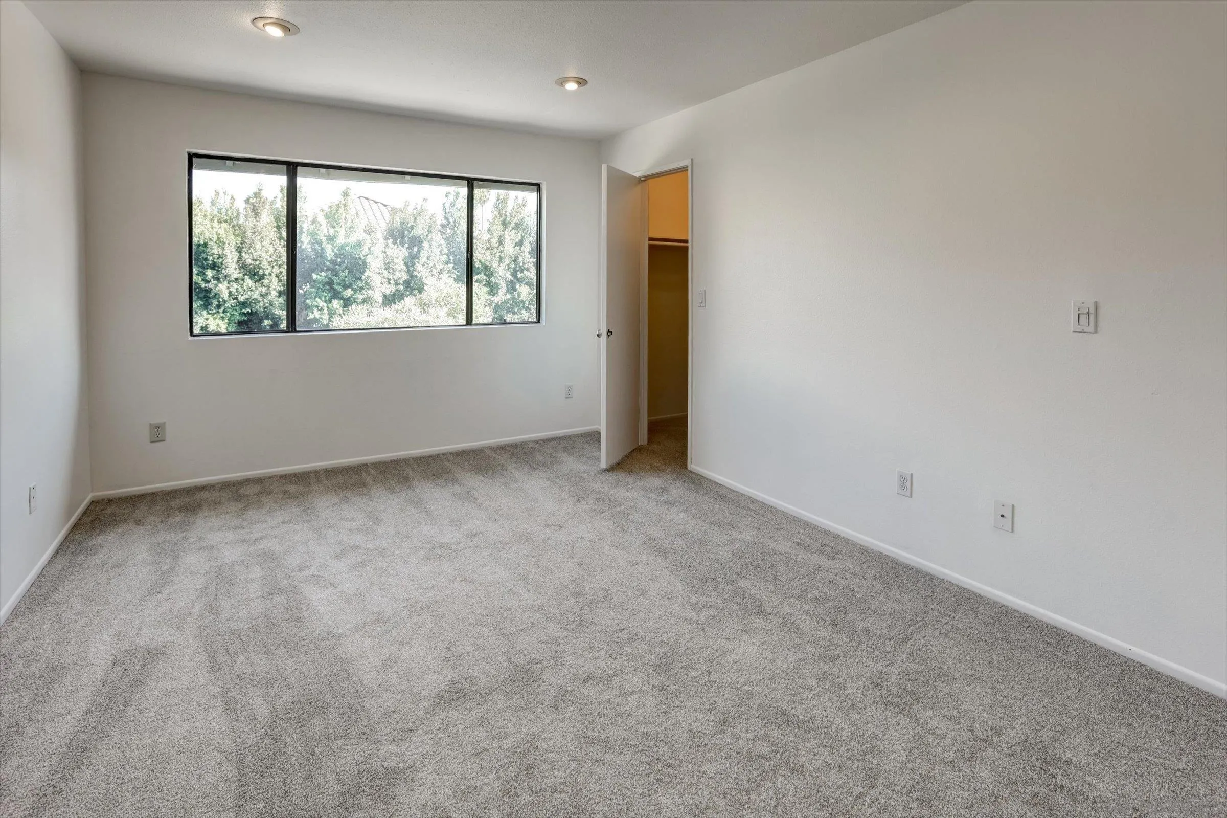 13230 Johannesberg Way, Unit 10 Poway, CA 92064 - Photo 24 of 40 an empty room with windows