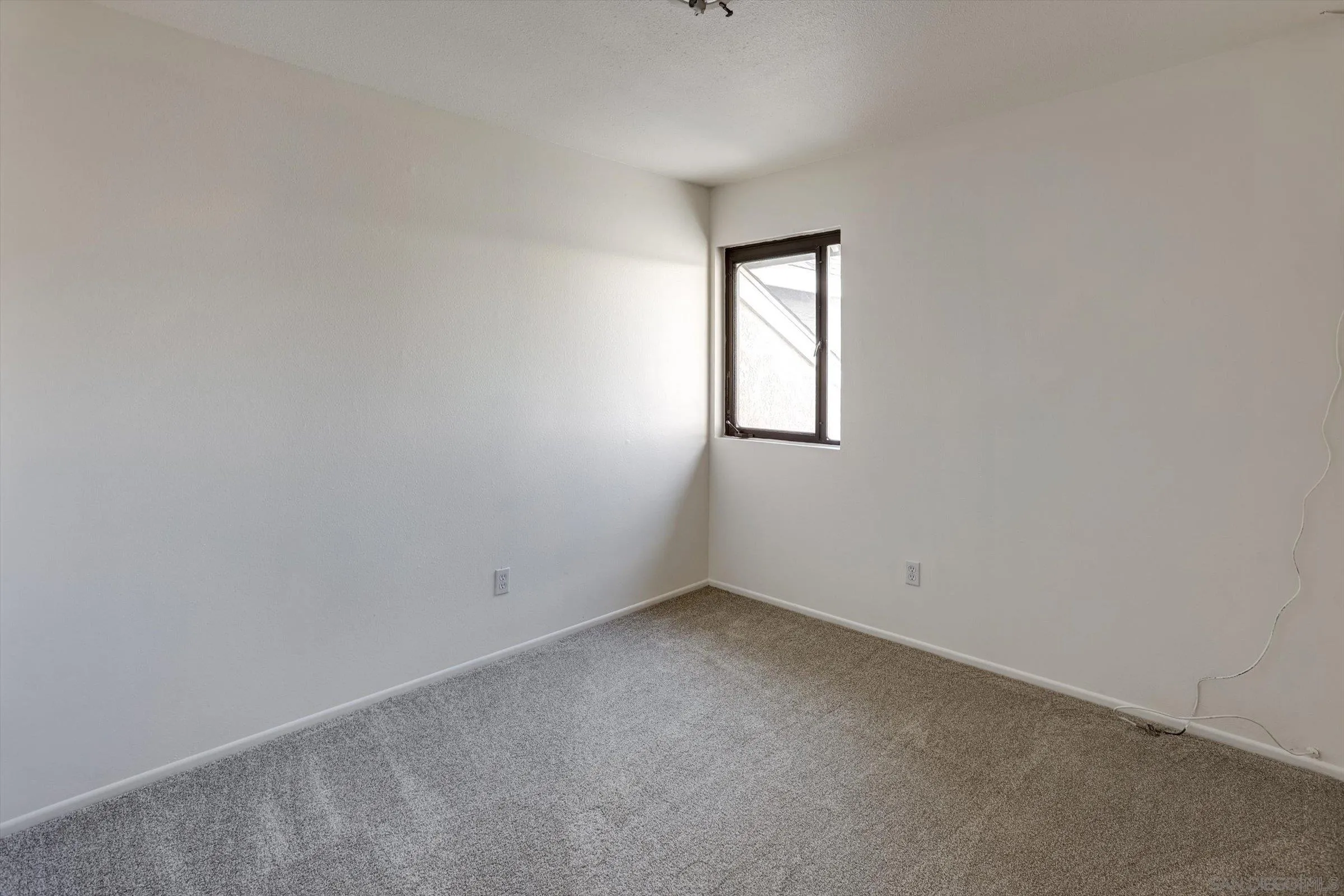 13230 Johannesberg Way, Unit 10 Poway, CA 92064 - Photo 30 of 40 an empty room with a window