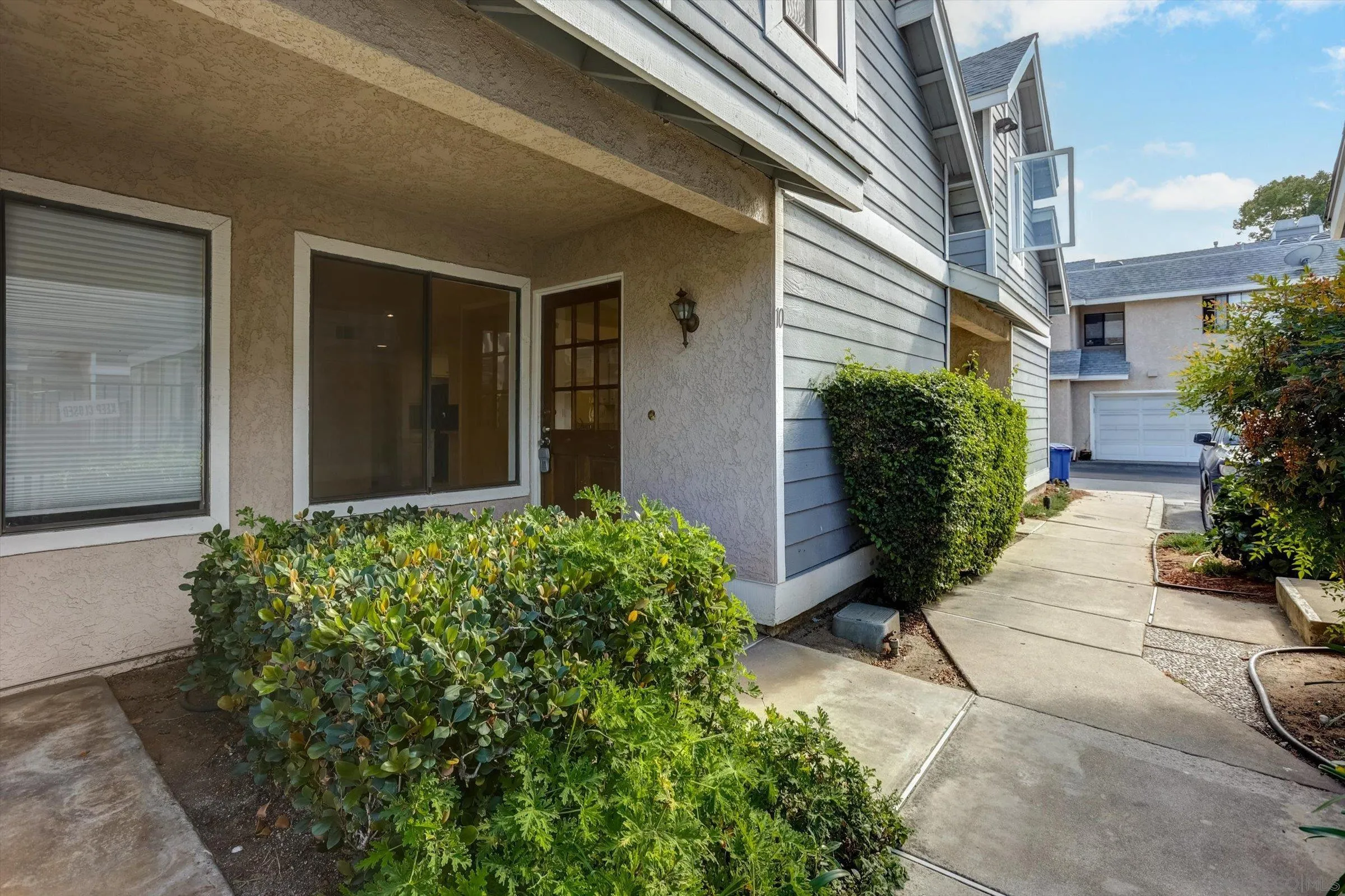 13230 Johannesberg Way, Unit 10 Poway, CA 92064 - Photo 3 of 40 a view of a pathway with a house in front of main door