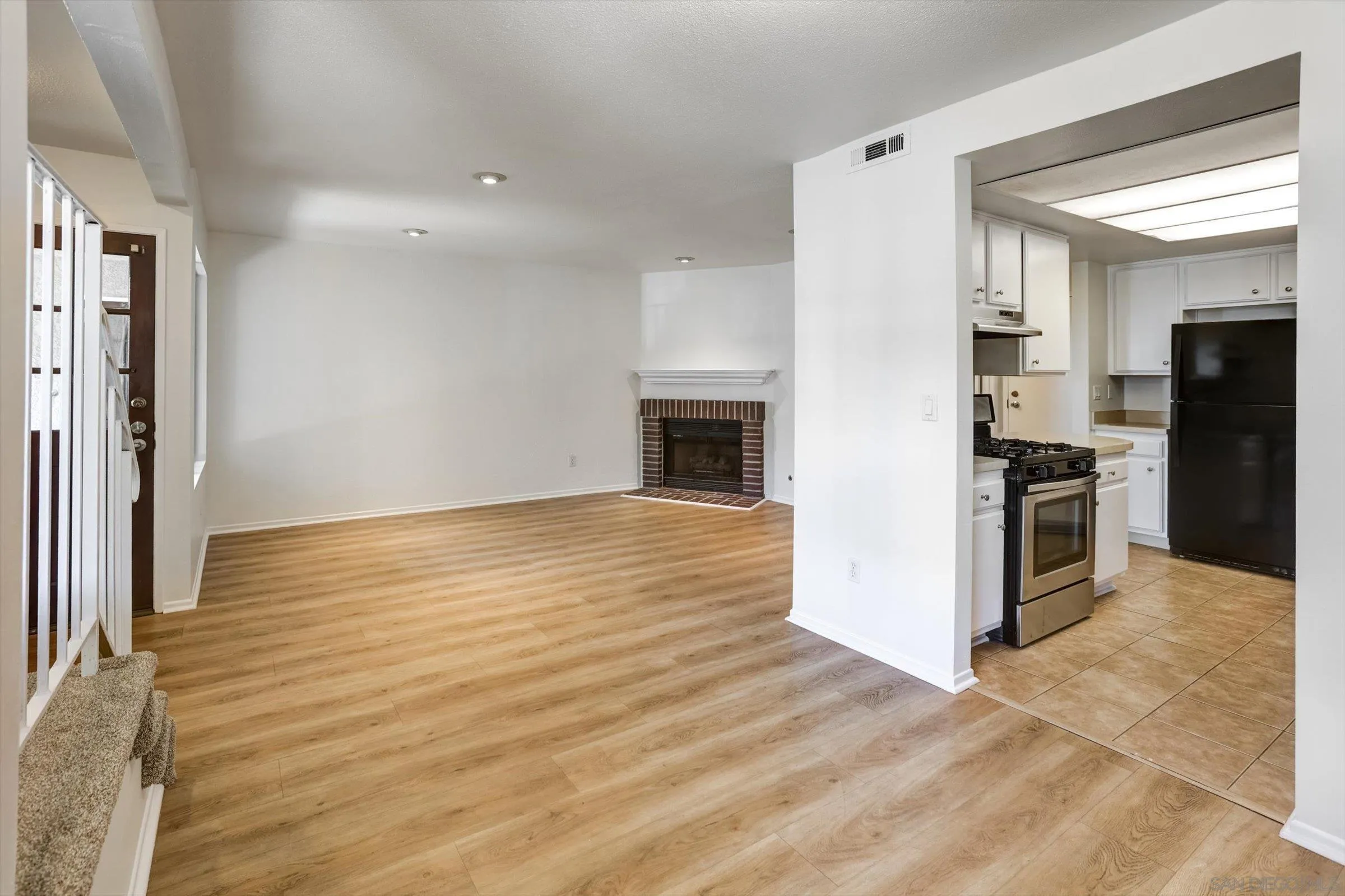 13230 Johannesberg Way, Unit 10 Poway, CA 92064 - Photo 4 of 40 an empty room with kitchen appliances and cabinets