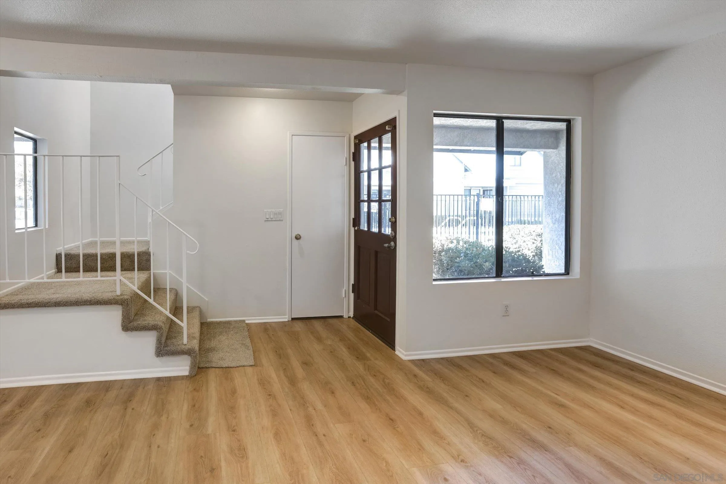 13230 Johannesberg Way, Unit 10 Poway, CA 92064 - Photo 8 of 40 a view of empty room with wooden floor and fan