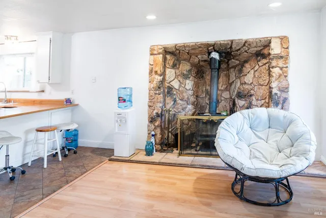a kitchen with stainless steel appliances granite countertop a sink and a microwave