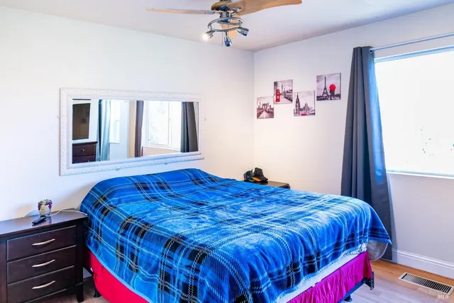 a bathroom with a granite countertop sink a toilet and bathtub