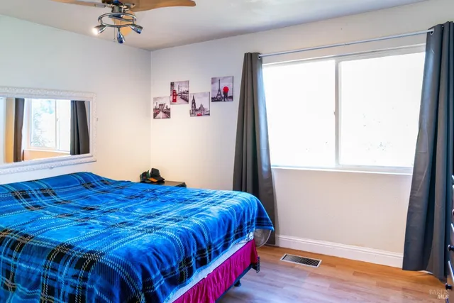 a bedroom with a bed and with furniture