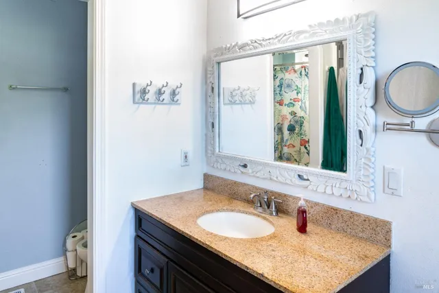 a bathroom with a toilet a sink and bathtub