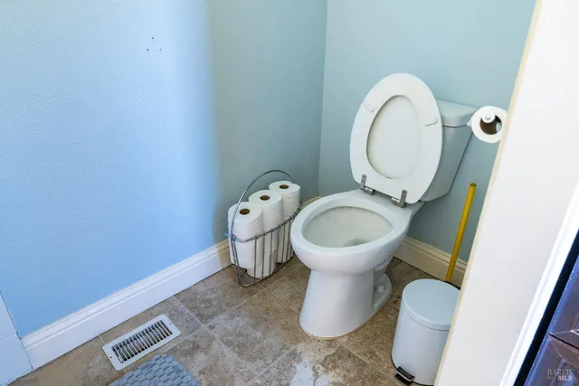 a bedroom with a bed and a lamp on table