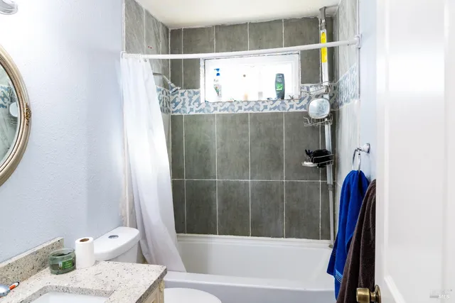 a kitchen with a stove and a microwave