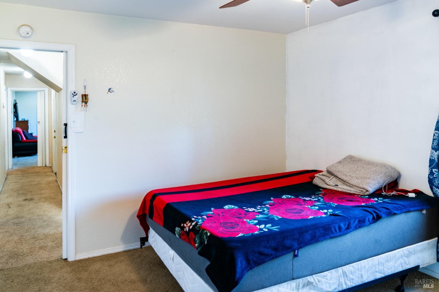 32 Boxelder Court Napa, CA 94558 - Photo 56 of 75 a bedroom with a bed and a mirror