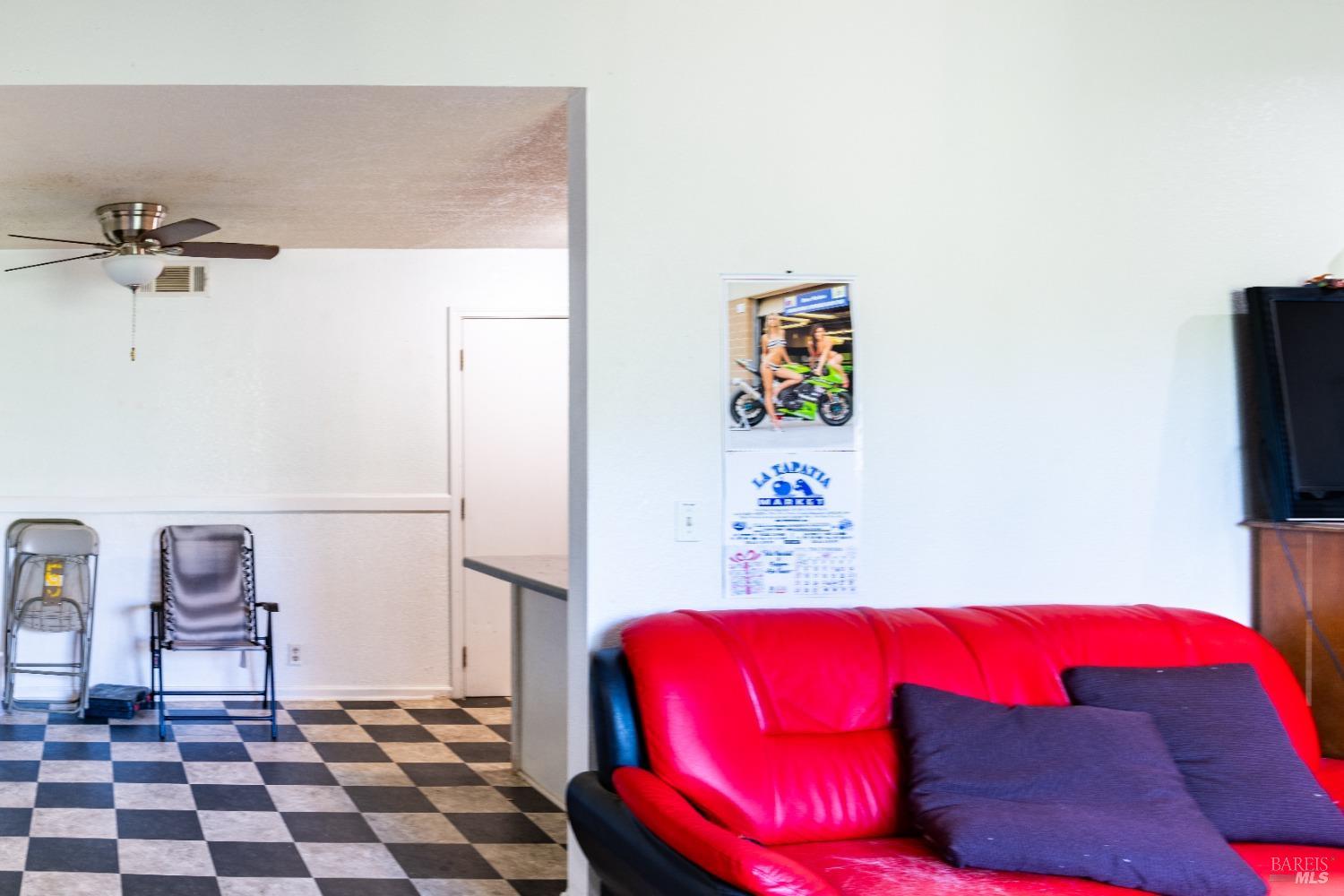 32 Boxelder Court Napa, CA 94558 - Photo 67 of 75 a bedroom with a bed and a lamp on table