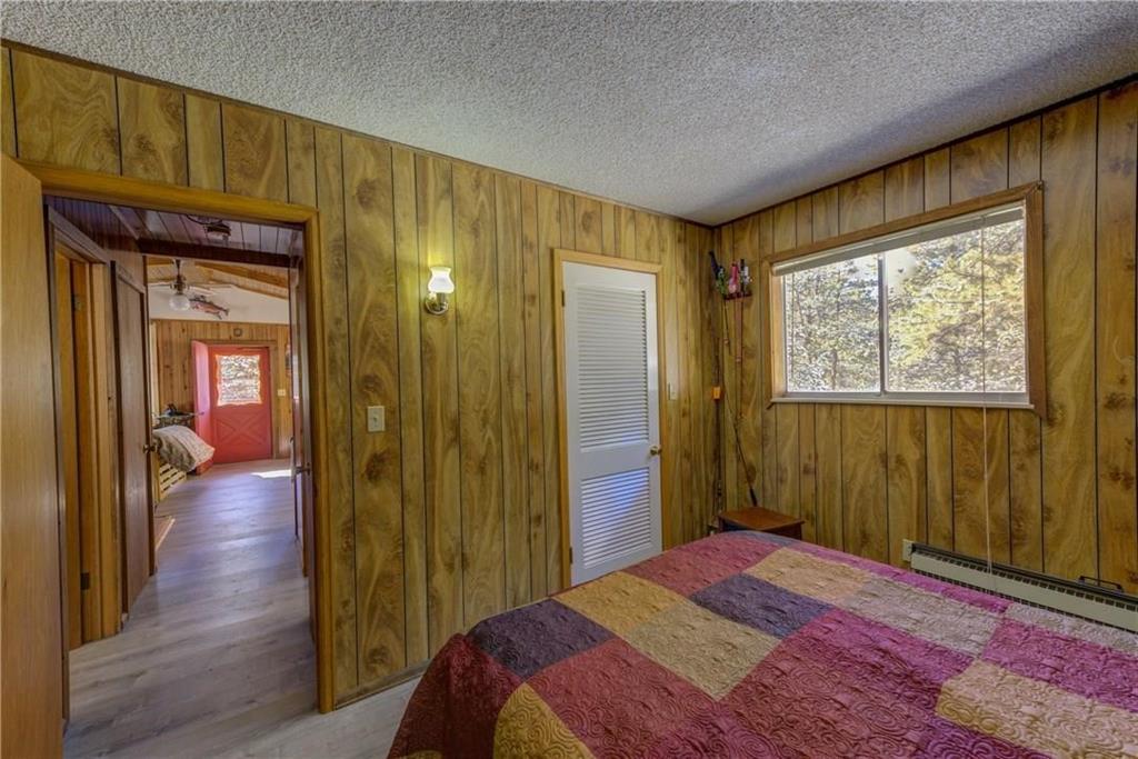 1428 South Crystal Road Lake George, CO 80827 - Photo 22 of 35 a bedroom with a bed and a mirror