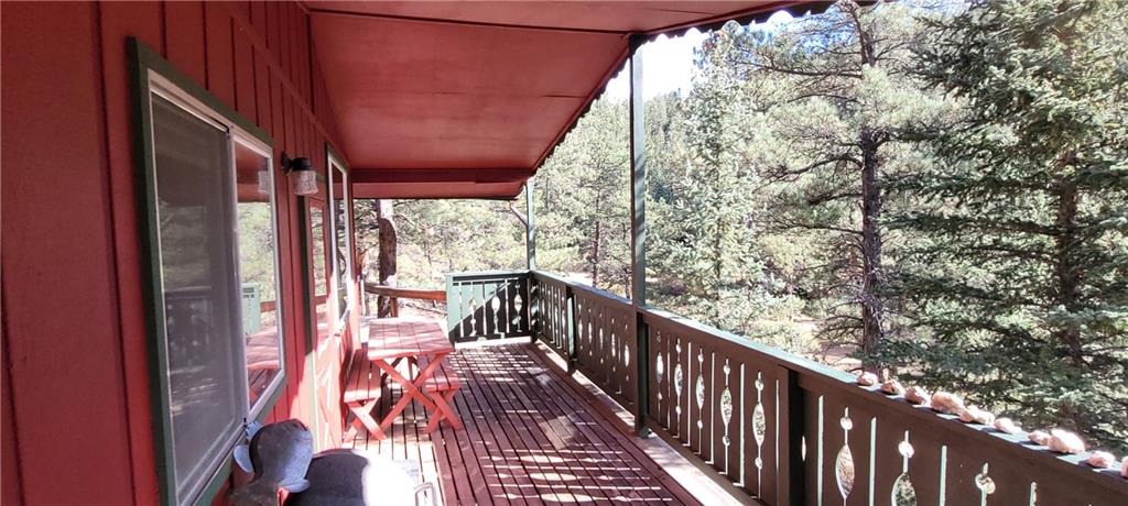 1428 South Crystal Road Lake George, CO 80827 - Photo 23 of 35 a view of balcony with wooden floor