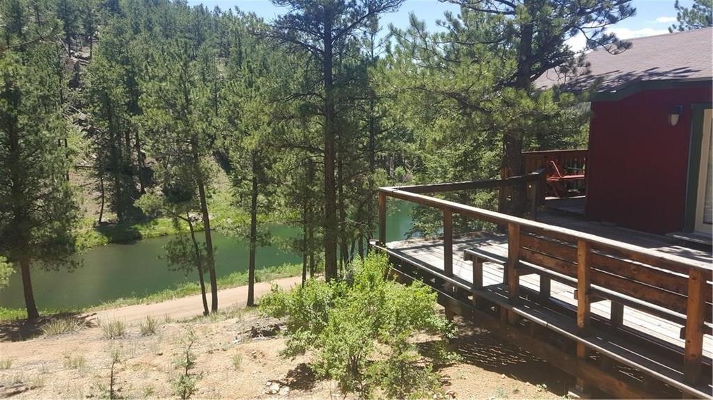 1428 South Crystal Road Lake George, CO 80827 - Photo 4 of 35 a view of balcony with two trees