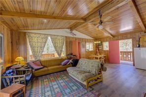 1428 South Crystal Road Lake George, CO 80827 - Photo 7 of 35 a living room with furniture and a large window