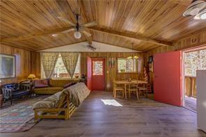 1428 South Crystal Road Lake George, CO 80827 - Photo 9 of 35 a living room with furniture and wooden floor