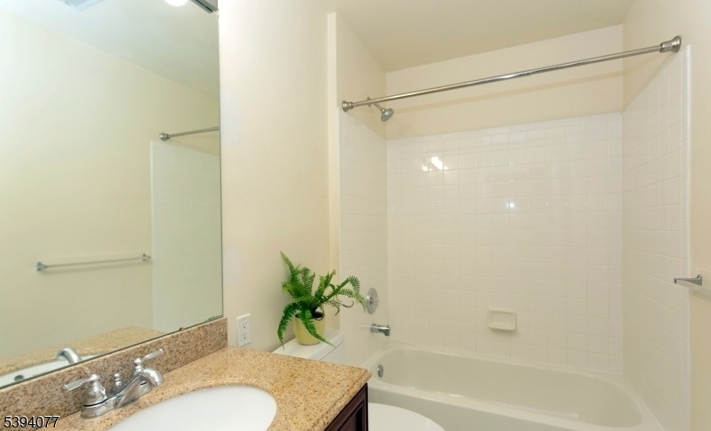 3 Minuteman Court Bernards, NJ 07920 - Photo 12 of 12 a bathroom with a granite countertop shower and a sink