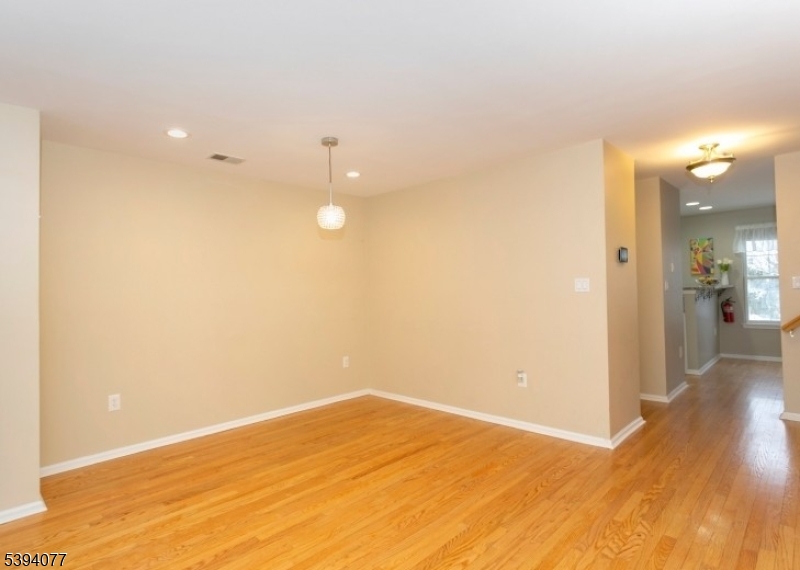 3 Minuteman Court Bernards, NJ 07920 - Photo 5 of 12 a view of empty room with wooden floor
