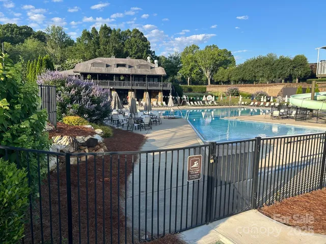 a view of a park with swings and slides