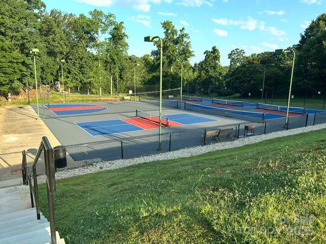 a view of a swimming pool with outdoor seating