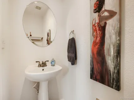 a bathroom with a sink and mirror
