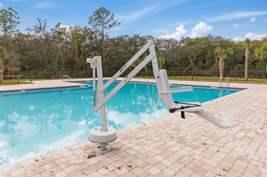 90 Rivertown Road Palm Coast, FL 32137 - Photo 58 of 60 a view of a lounge chair and tables in the patio