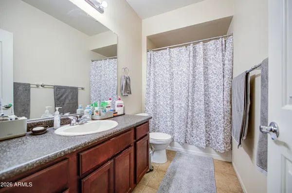 a bathroom with a sink vanity and a mirror