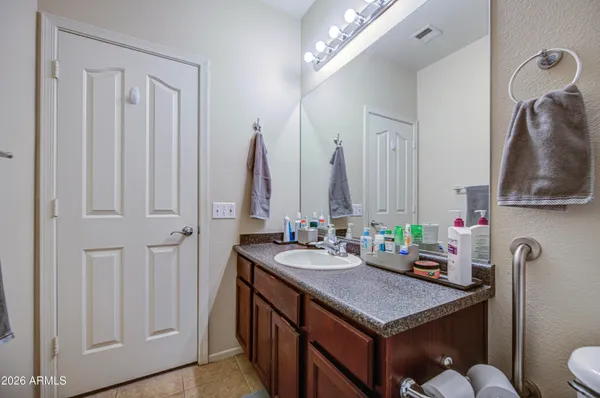 a view of walk in closet with clothes