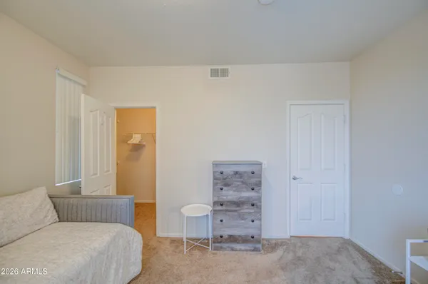 a bathroom with a double vanity sink toilet and a mirror