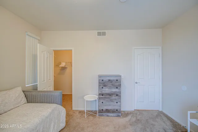 a bathroom with a double vanity sink toilet and a mirror