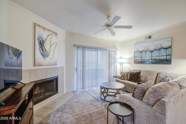a living room with furniture and a fireplace