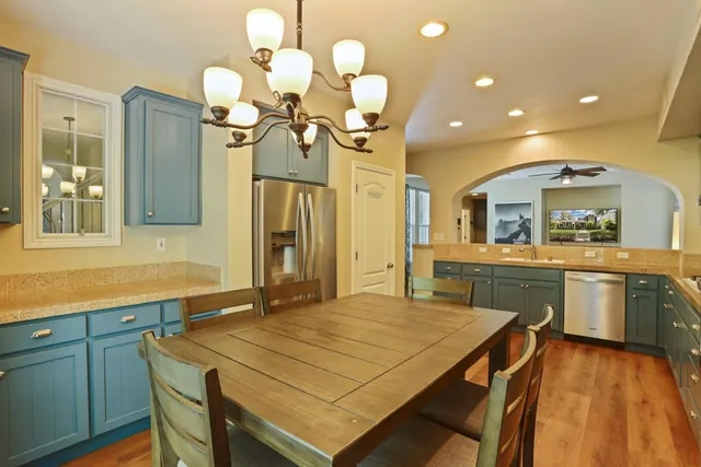 a kitchen with a table and chairs in it