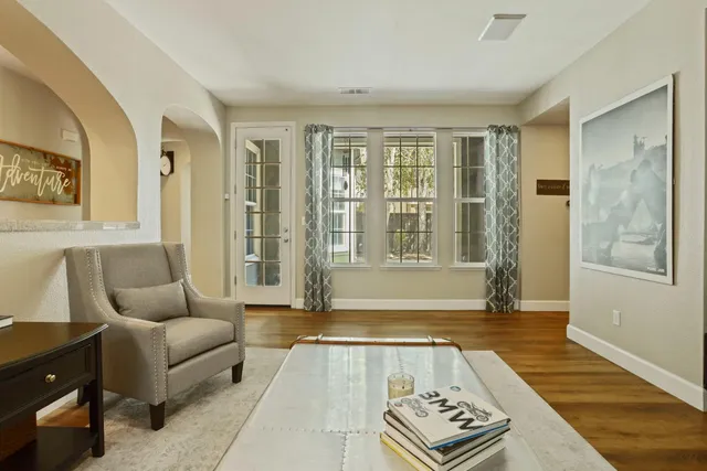 a living room with furniture and a rug