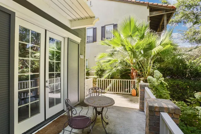 a view of a chair and table in the balcony